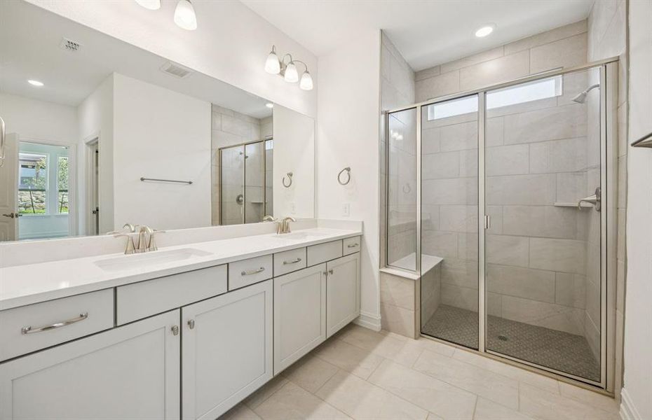 Luxurious owner's bath complete with double sinks and a generous shower *Real home pictured Luxurious owner's bath complete with double sinks and a generous shower *Real home pictured
