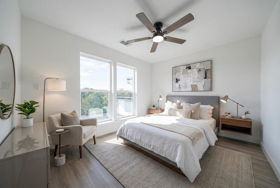 Bedroom with wood finished floors and a ceiling fan