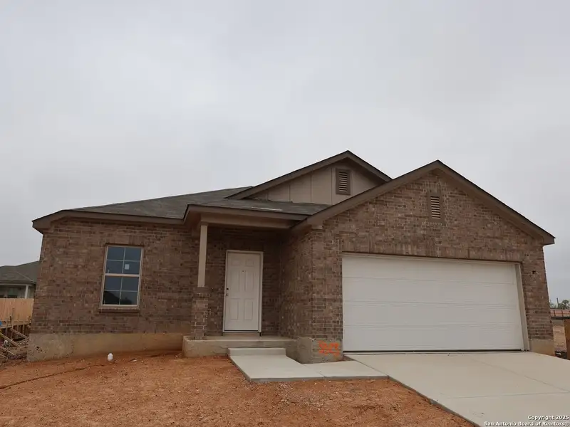 Front exterior of a new home in Paloma Park, Converse, TX, highlighting curb appeal (Image 15).
