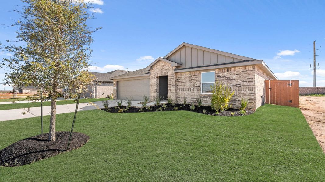 Front exterior of a new home in Sunterra Lakes, Brookshire, TX, highlighting curb appeal (Image 15).