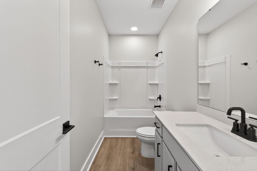 Representative furnished interior of a home built from the Atlas Interior Unit by Baker Residential in Atwater Station - Midtown Collection, Fuquay Varina (Image 18).