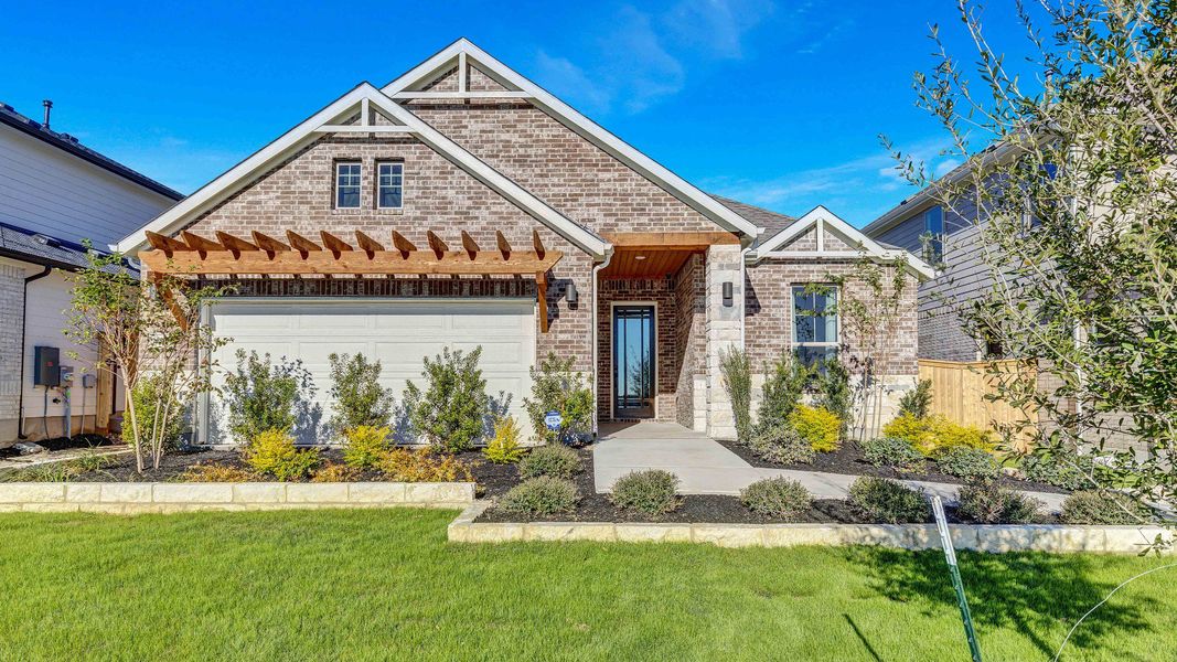 Representative exterior photo of a completed home built from the Palm by DRB Homes in Newhaven, Manor, TX (Image 23). Representative exterior photo of a completed home built from the Palm by DRB Homes in Newhaven, Manor, TX (Image 23).