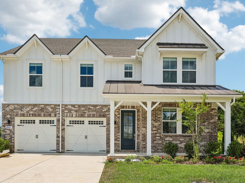 Front exterior of a new home in Station Hill - Estate Series, Franklin, TN, highlighting curb appeal (Image 1). Front exterior of a new home in Station Hill - Estate Series, Franklin, TN, highlighting curb appeal (Image 1).