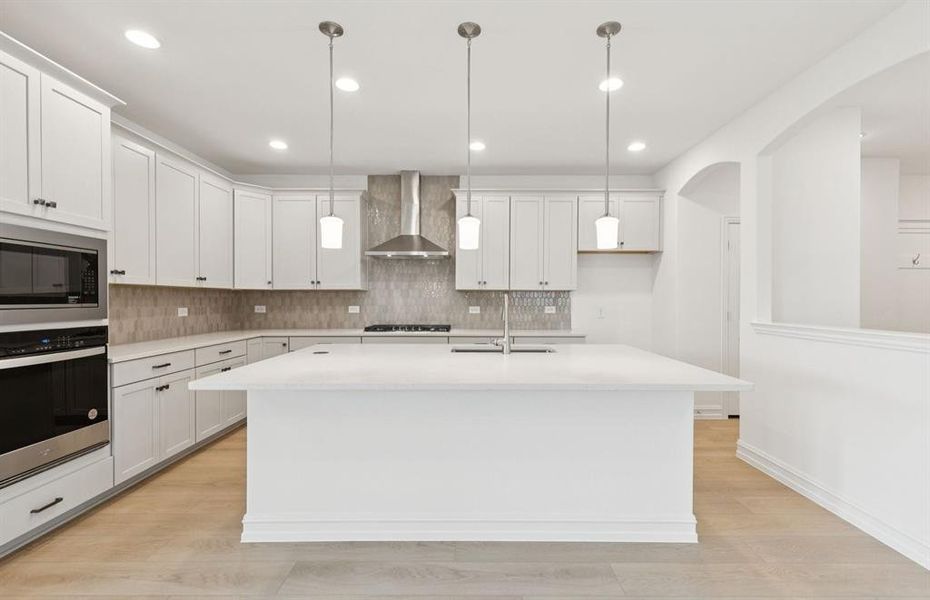 Kitchen featuring a large island ideal for informal dining and gatherings  *Real home pictured