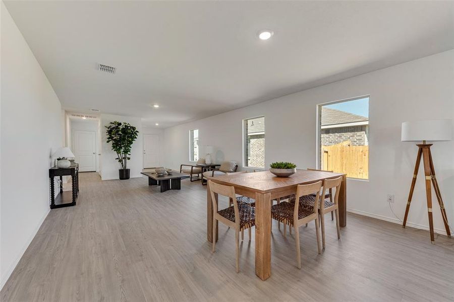 Dining space with light wood-type flooring