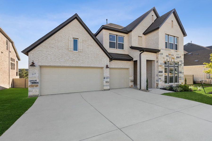 Front exterior of a new home in Wolf Ranch – West Bend, Georgetown, TX, highlighting curb appeal (Image 27).