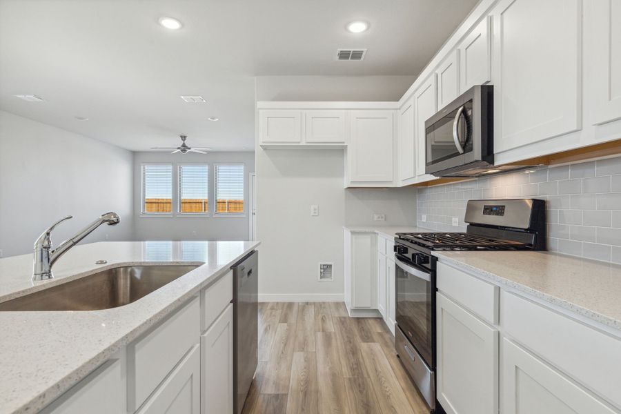 Kitchen in the Willow home plan by Trophy Signature Homes – REPRESENTATIVE PHOTO