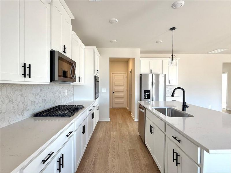 Furnished interior view inside a new home in Vines at Mill Creek - Estate Series, Braselton (Image 5).
