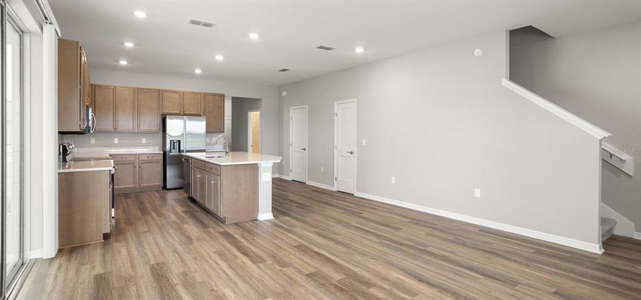 Furnished interior view inside a new home in Estates at Hickory Cove - Bungalows, St. Cloud (Image 8).