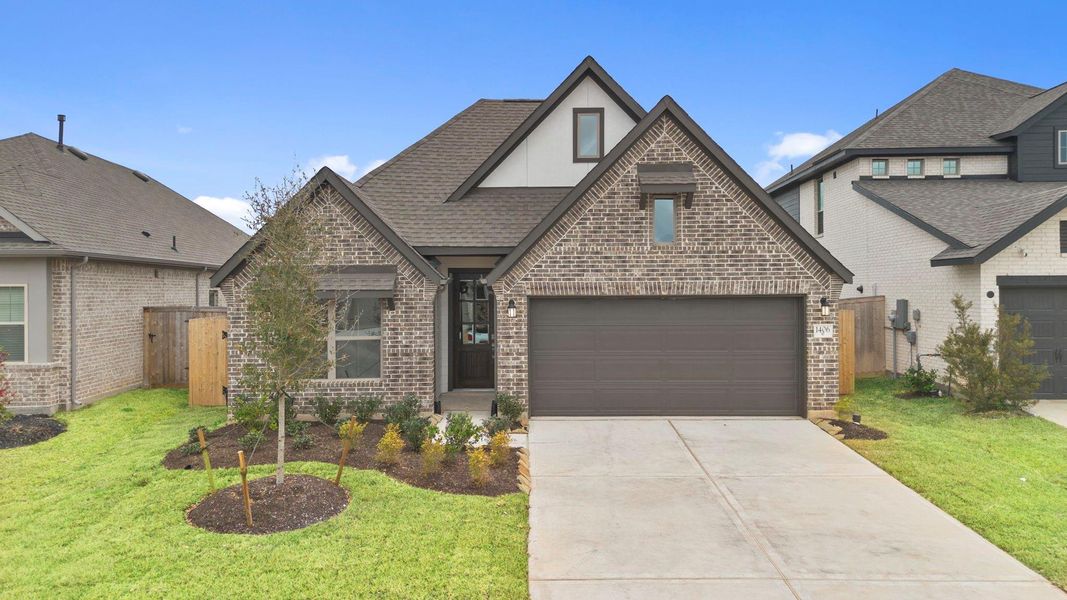 Front exterior of a new home in Escondido, Magnolia, TX, highlighting curb appeal (Image 13).