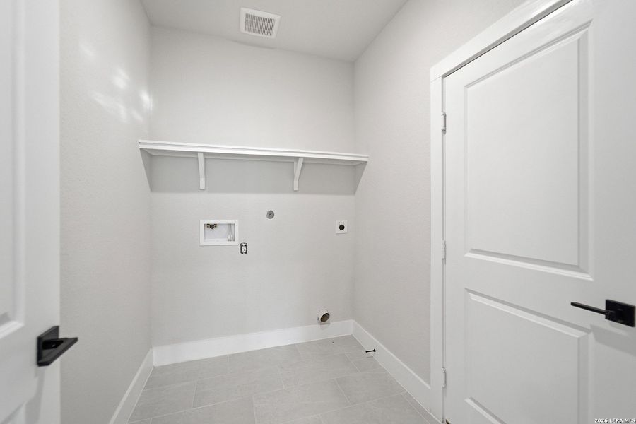 Spacious, unfurnished interior of a new home in The Woodlands at Medina Hills, Mico (Image 36).