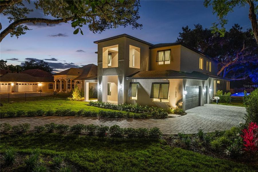 Front exterior of a new home in , Windermere, FL, highlighting curb appeal (Image 27).