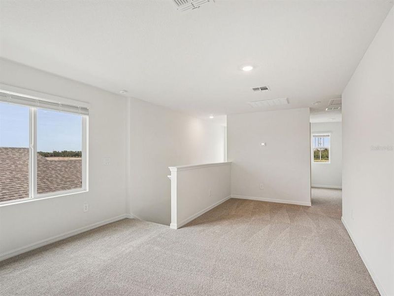 Spacious, unfurnished interior of a new home in Coasterra - Premier Series, Palmetto (Image 20).