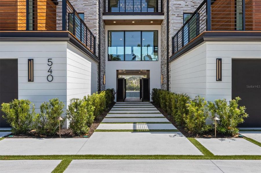 Front exterior of a new home in , Sarasota, FL, highlighting curb appeal (Image 20).