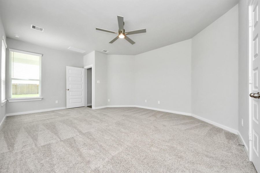 Come and unwind after a long day in this magnificent primary suite! This spacious room features plush carpet, warm paint, high ceilings and large windows with privacy blinds. Sample photo of completed home with similar floor plan. Actual colors and selections may vary. Come and unwind after a long day in this magnificent primary suite! This spacious room features plush carpet, warm paint, high ceilings and large windows with privacy blinds. Sample photo of completed home with similar floor plan. Actual colors and selections may vary.