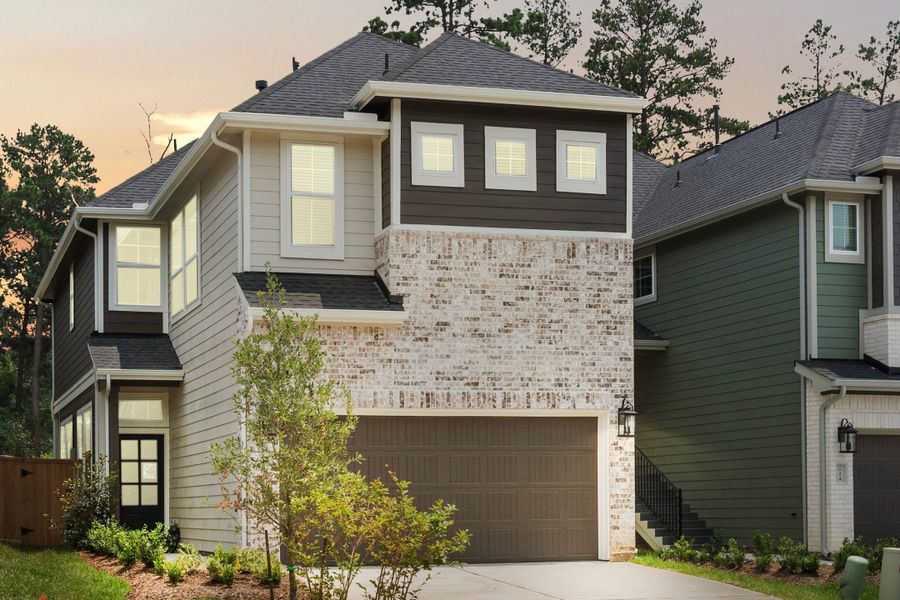 Front exterior of a new home in The Woodlands Hills, Willis, TX, highlighting curb appeal (Image 27). Front exterior of a new home in The Woodlands Hills, Willis, TX, highlighting curb appeal (Image 27).