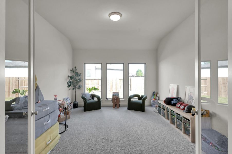 Bonus flex room featuring French doors with glass panels, offering a bright and versatile space. Bonus flex room featuring French doors with glass panels, offering a bright and versatile space.