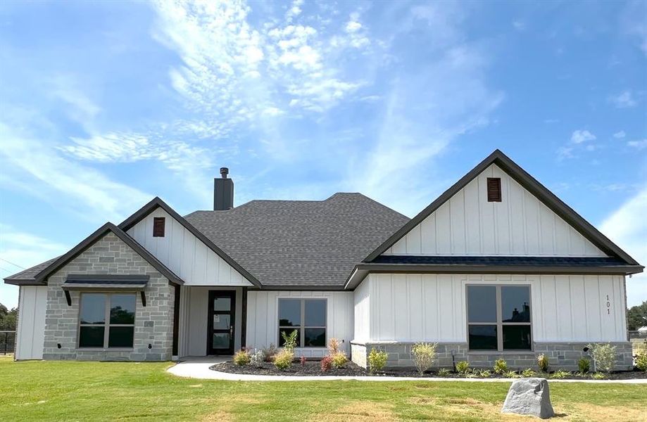 Front exterior of a new home in , Poolville, TX, highlighting curb appeal (Image 1). Front exterior of a new home in , Poolville, TX, highlighting curb appeal (Image 1).