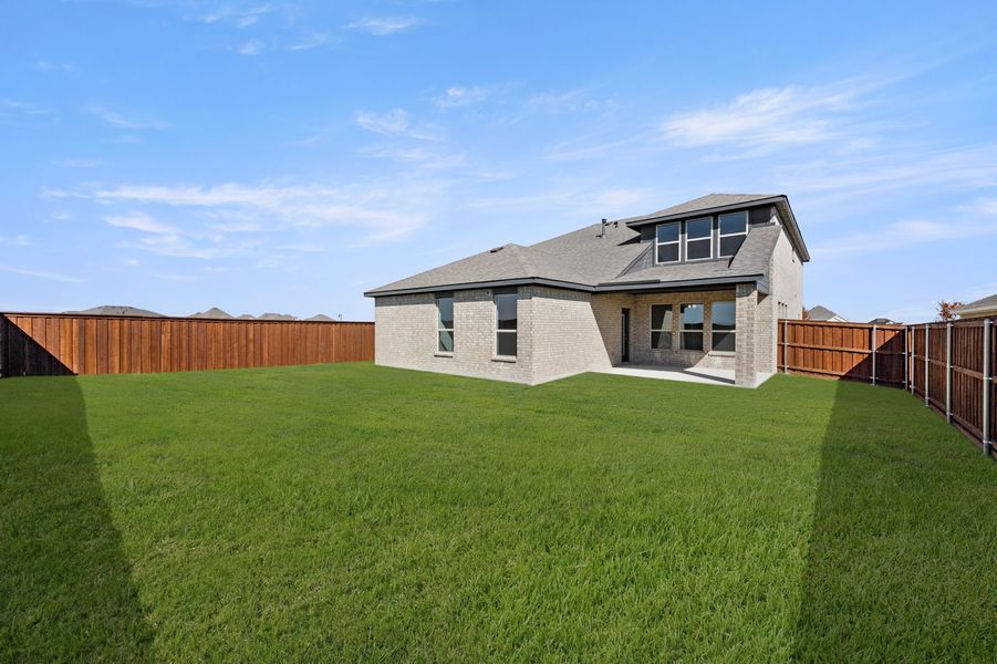 Front exterior of a new home in Myrtle Creek, Waxahachie, TX, highlighting curb appeal (Image 27). Front exterior of a new home in Myrtle Creek, Waxahachie, TX, highlighting curb appeal (Image 27).