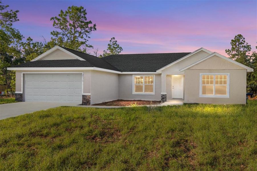 Front exterior of a new home in , Dunnellon, FL, highlighting curb appeal (Image 1).