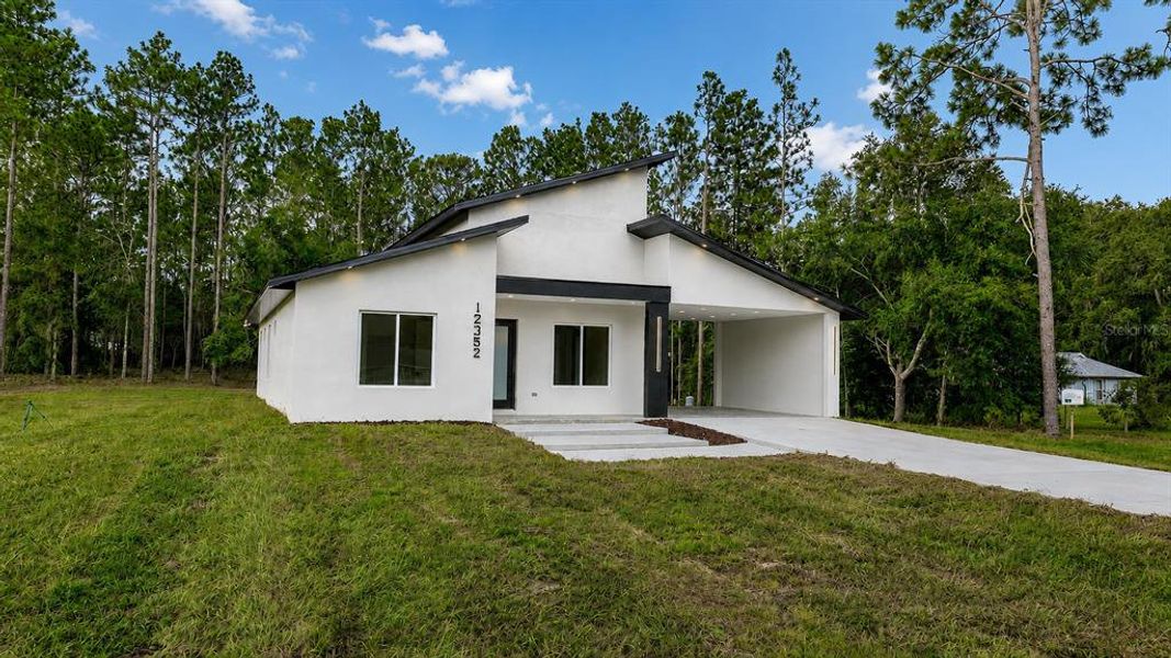 Front exterior of a new home in , Ocala, FL, highlighting curb appeal (Image 21).