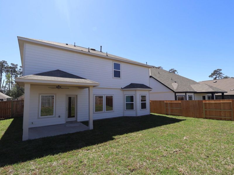 Exterior details and patio area of a home in Moran Ranch, Willis (Image 18).