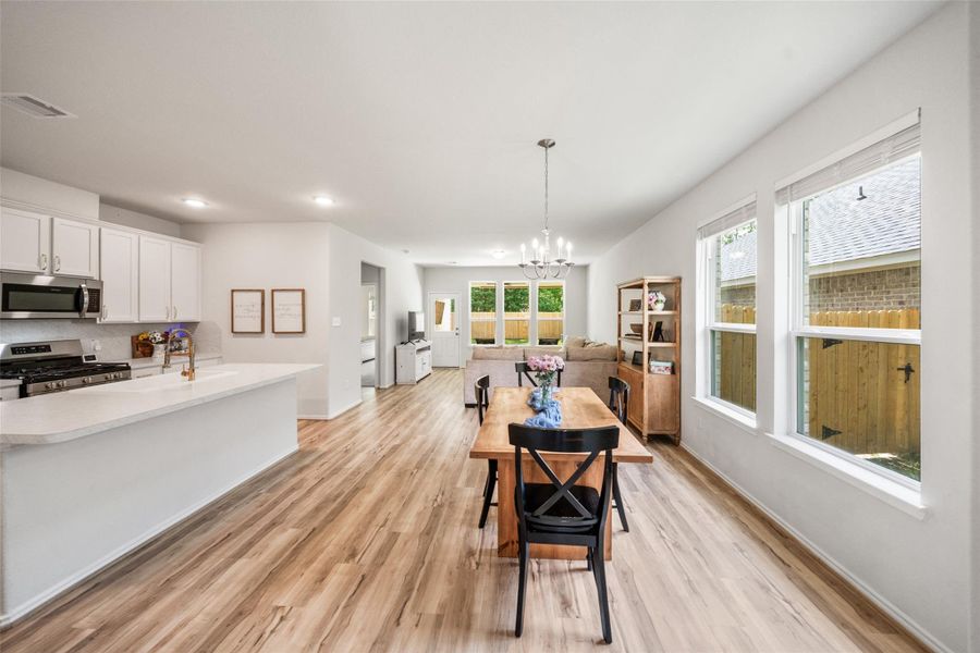 Open floor plan and lots of natural light brighten the living and dining area