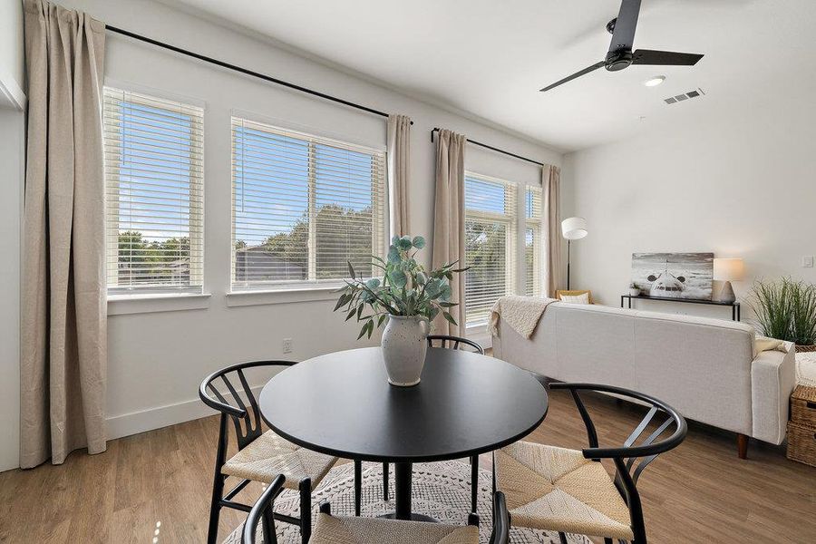 Dining room featuring light wood-style floors and ceiling fan