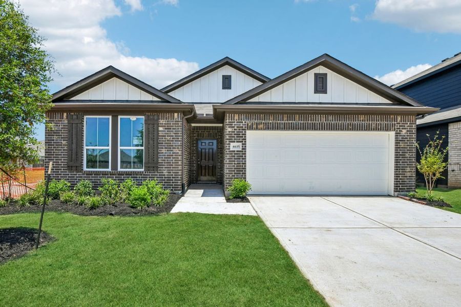 Front exterior of a new home in Colony at Pinehurst, Pinehurst, TX, highlighting curb appeal (Image 1). Front exterior of a new home in Colony at Pinehurst, Pinehurst, TX, highlighting curb appeal (Image 1).