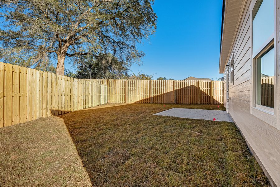 Exterior details and patio area of a home in Live Oak Cottages, Freeport (Image 25).