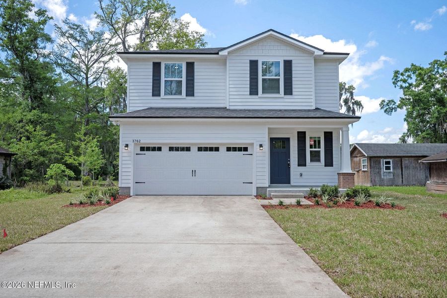 Front exterior of a new home in , Jacksonville, FL, highlighting curb appeal (Image 1). Front exterior of a new home in , Jacksonville, FL, highlighting curb appeal (Image 1).