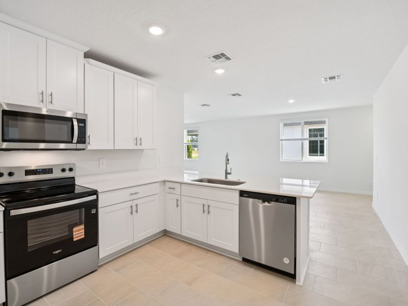 Furnished interior view inside a new home in Ridgehaven - Villas, Ormond Beach (Image 3).