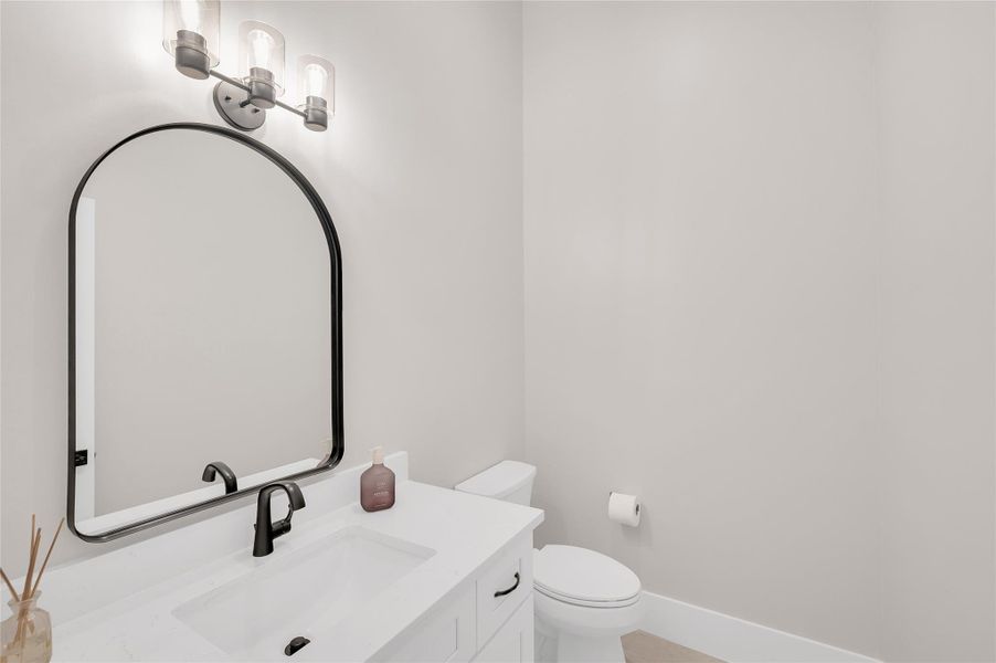 Half bath across from the mud bench