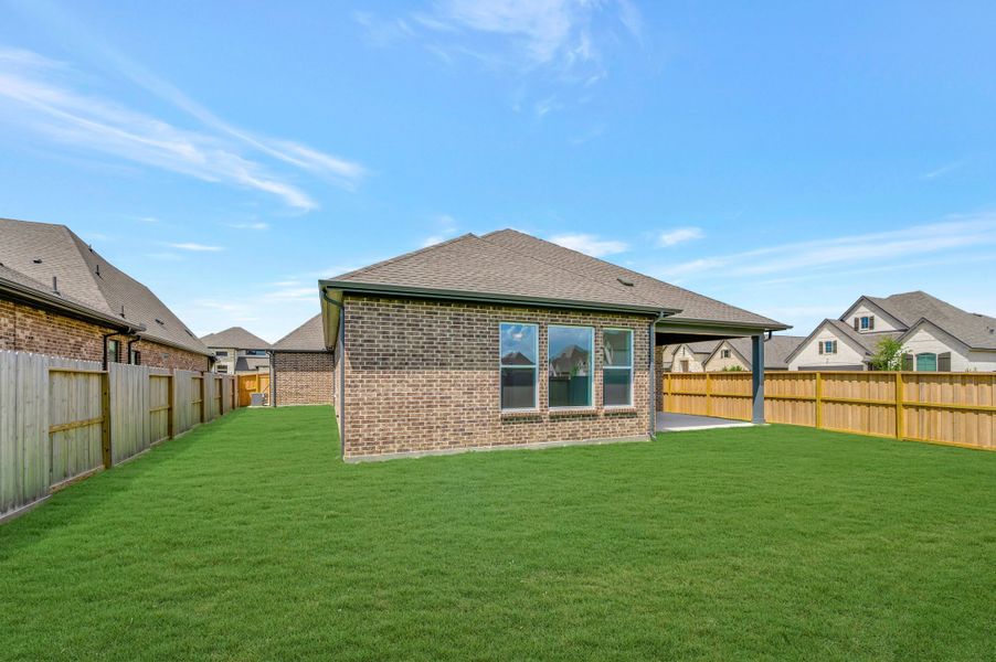 Exterior details and patio area of a home in Riceland - Enclave Collection, Mont Belvieu (Image 3). Exterior details and patio area of a home in Riceland - Enclave Collection, Mont Belvieu (Image 3).