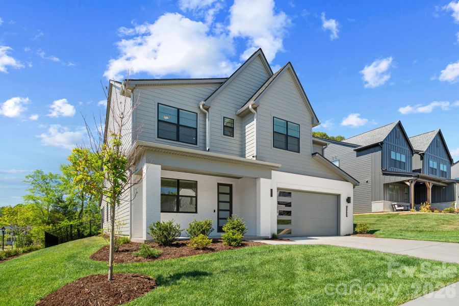 Front exterior of a new home in Amara Chase, Huntersville, NC, highlighting curb appeal (Image 24).