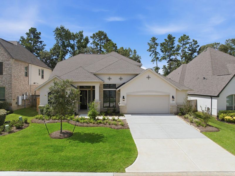 Front exterior of a new home in The Woodlands Hills 65′, Willis, TX, highlighting curb appeal (Image 25).