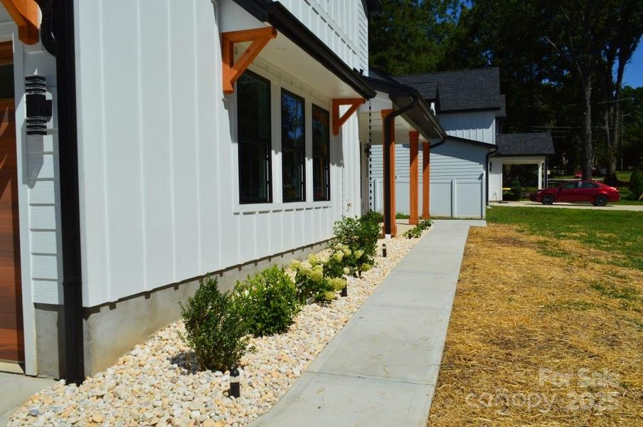 Front exterior of a new home in , Davidson, NC, highlighting curb appeal (Image 27).