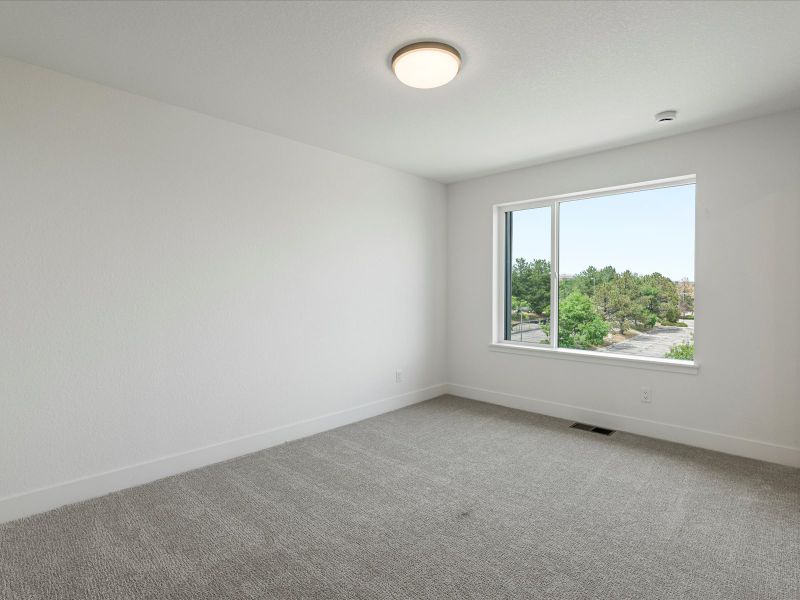 Representative unfurnished interior of a home built from the Nolan by Lokal Homes in The Commons at Victory Ridge, Colorado Springs (Image 8).