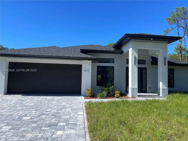 Front exterior of a new home in , Lehigh Acres, FL, highlighting curb appeal (Image 1). Front exterior of a new home in , Lehigh Acres, FL, highlighting curb appeal (Image 1).