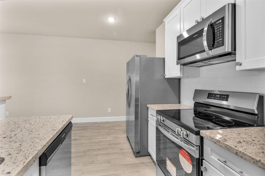 Furnished interior view inside a new home in , Willis (Image 6).