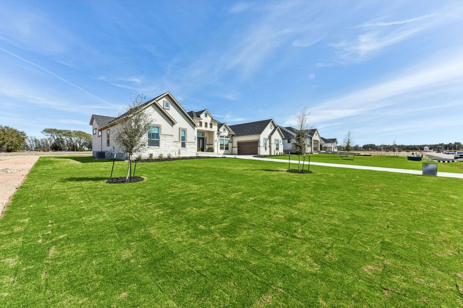 Front exterior of a new home in Feathergrass, Florence, TX, highlighting curb appeal (Image 29).