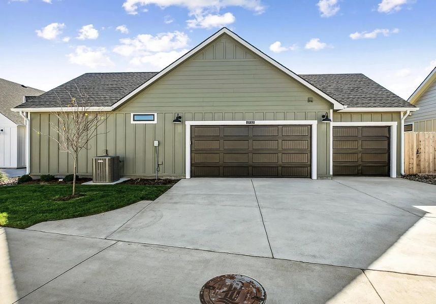 Front exterior of a new home in The Courtyards at The Moorings, Wichita, KS, highlighting curb appeal (Image 2). Front exterior of a new home in The Courtyards at The Moorings, Wichita, KS, highlighting curb appeal (Image 2).