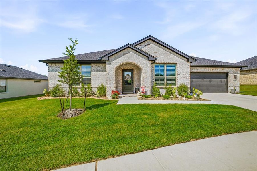 Front exterior of a new home in , Glen Rose, TX, highlighting curb appeal (Image 1). Front exterior of a new home in , Glen Rose, TX, highlighting curb appeal (Image 1).