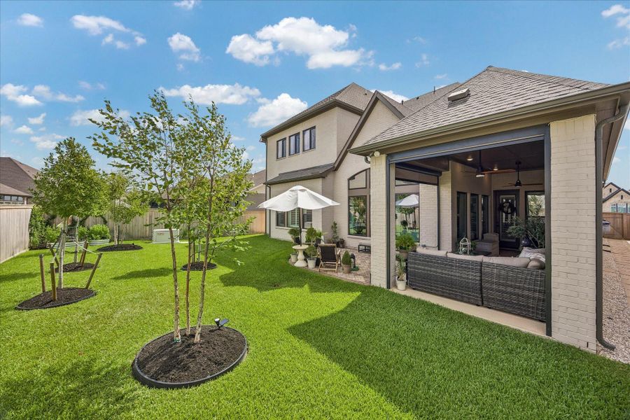 Exterior details and patio area of a home in Prairieland Village - Summit Collection, Cypress (Image 23).