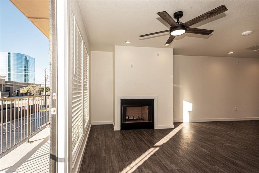 living room featuring the 2nd balcony and private door