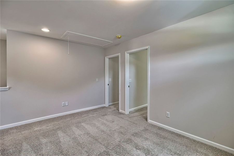 This versatile room offers plush carpeting and amp