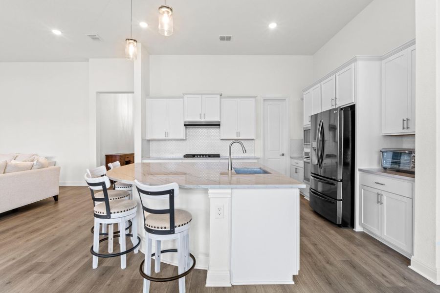 From the granite countertops and tile backsplash to the pendant lighting, every upgrade has been thoughtfully selected for lasting style.