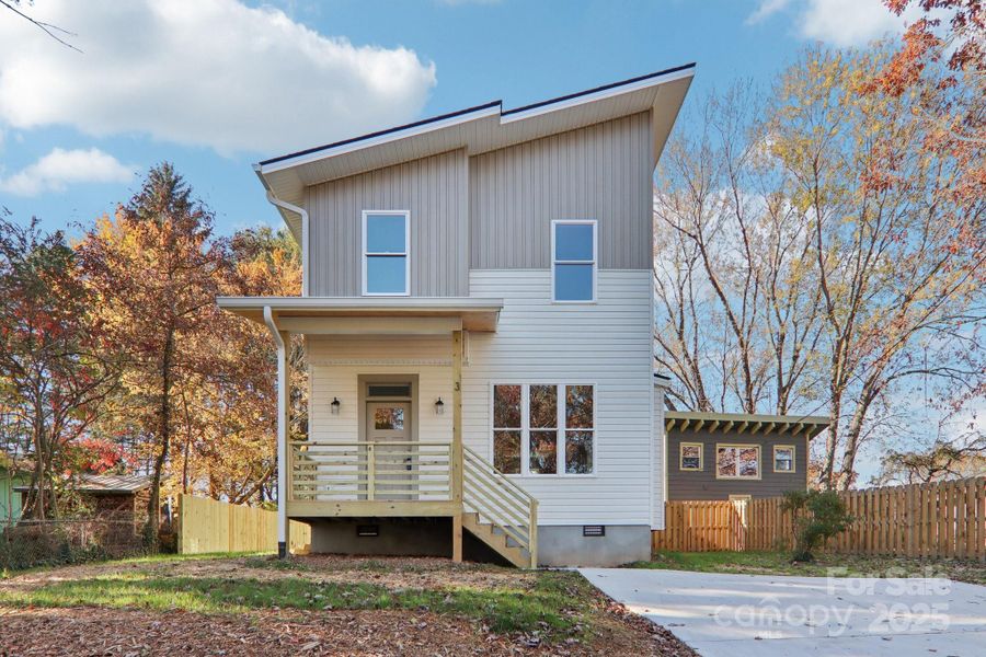 Exterior details and patio area of a home in , Asheville (Image 1).