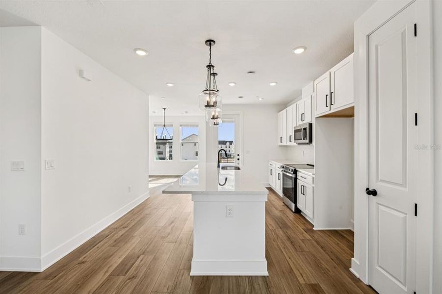 Furnished interior view inside a new home in Parkview at Hamlin, Winter Garden (Image 11).