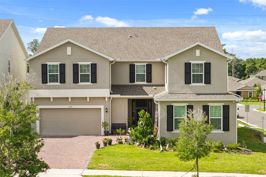 Front exterior of a new home in Beresford Woods, Deland, FL, highlighting curb appeal (Image 2). Front exterior of a new home in Beresford Woods, Deland, FL, highlighting curb appeal (Image 2).